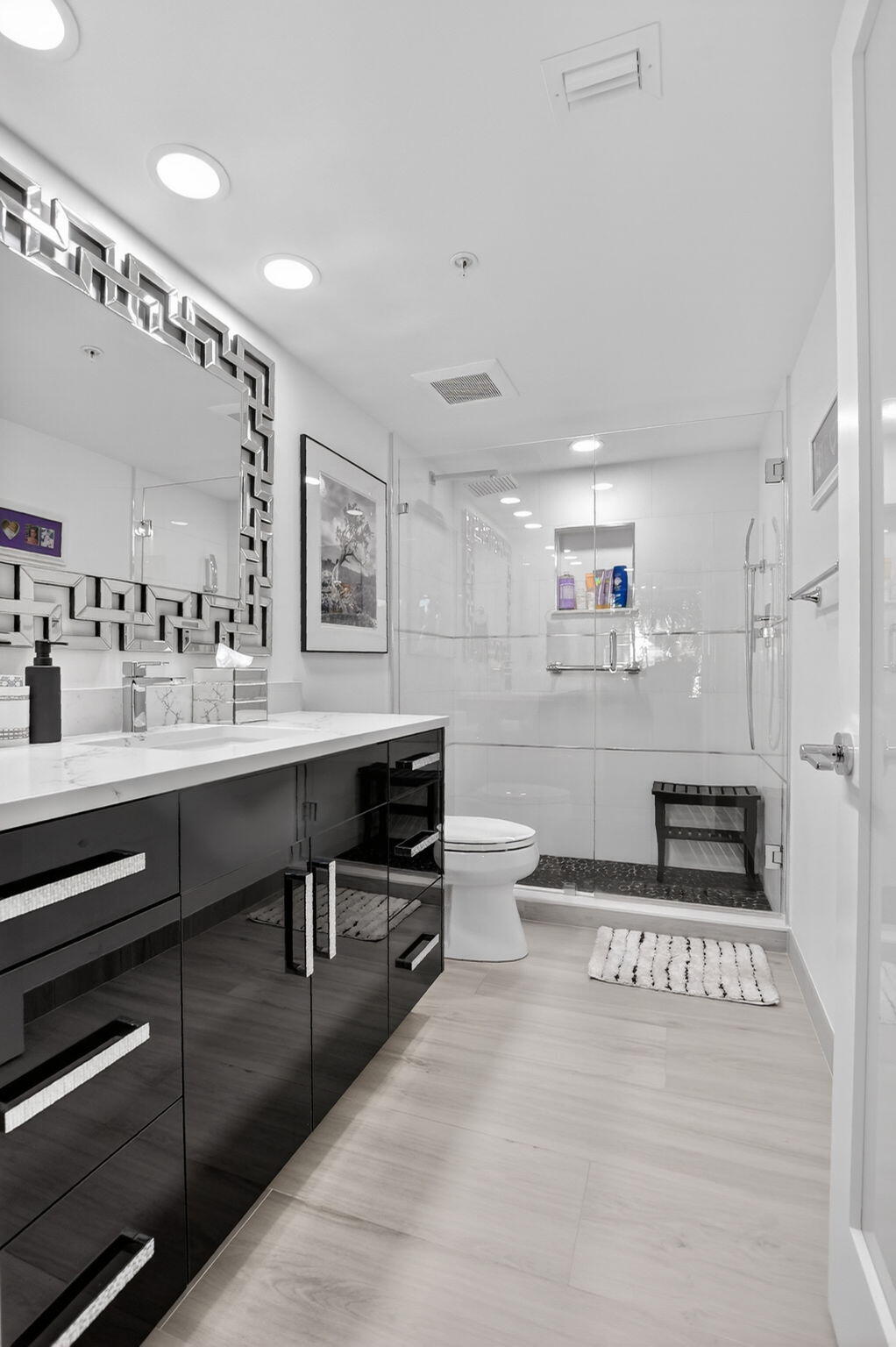 7802 Lakeside Boulevard, Unit 734 Boca Raton, FL 33434 - Photo 18 of 34 a kitchen with stainless steel appliances kitchen island granite countertop a stove and cabinets