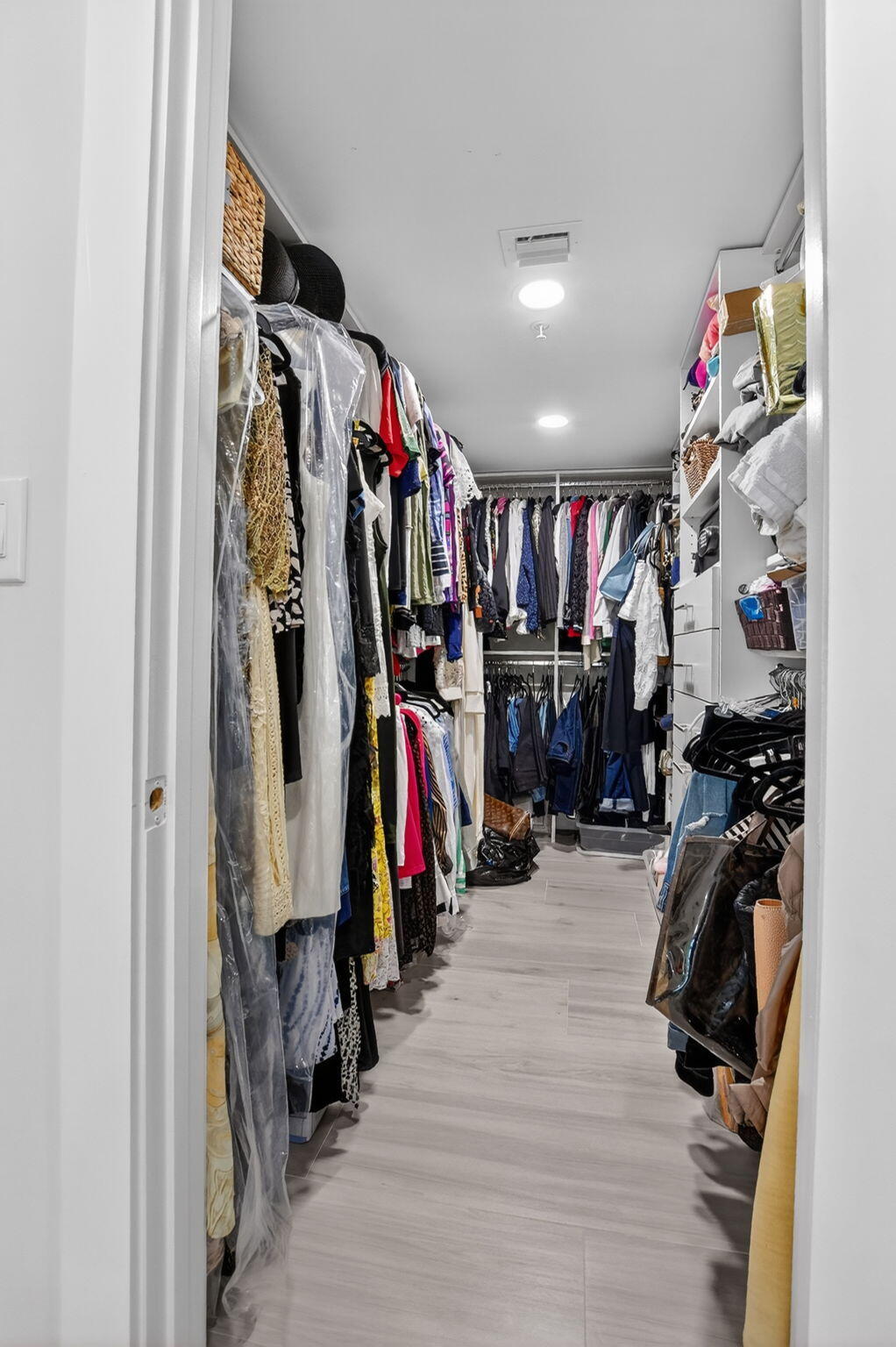 7802 Lakeside Boulevard, Unit 734 Boca Raton, FL 33434 - Photo 19 of 34 a view of walk in closet with clothes and shoes