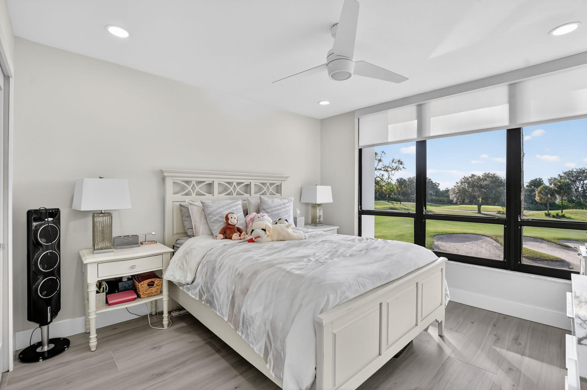 7802 Lakeside Boulevard, Unit 734 Boca Raton, FL 33434 - Photo 20 of 34 a bedroom with a bed and a large window