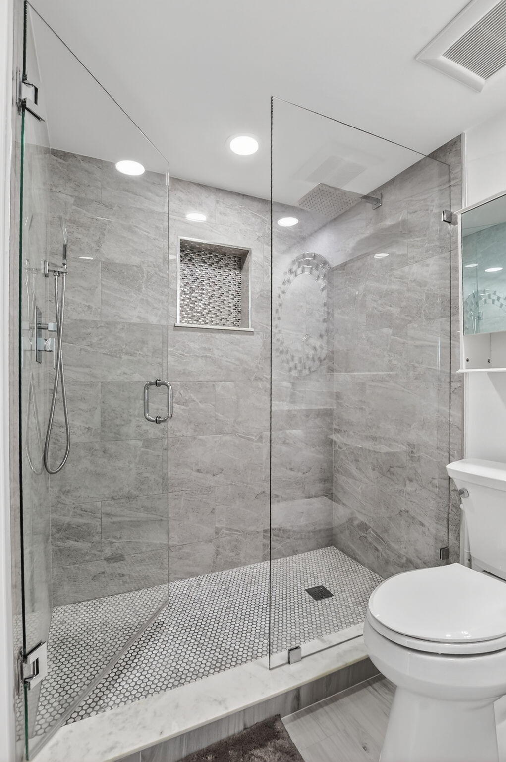 7802 Lakeside Boulevard, Unit 734 Boca Raton, FL 33434 - Photo 24 of 34 a bathroom with a shower and a toilet