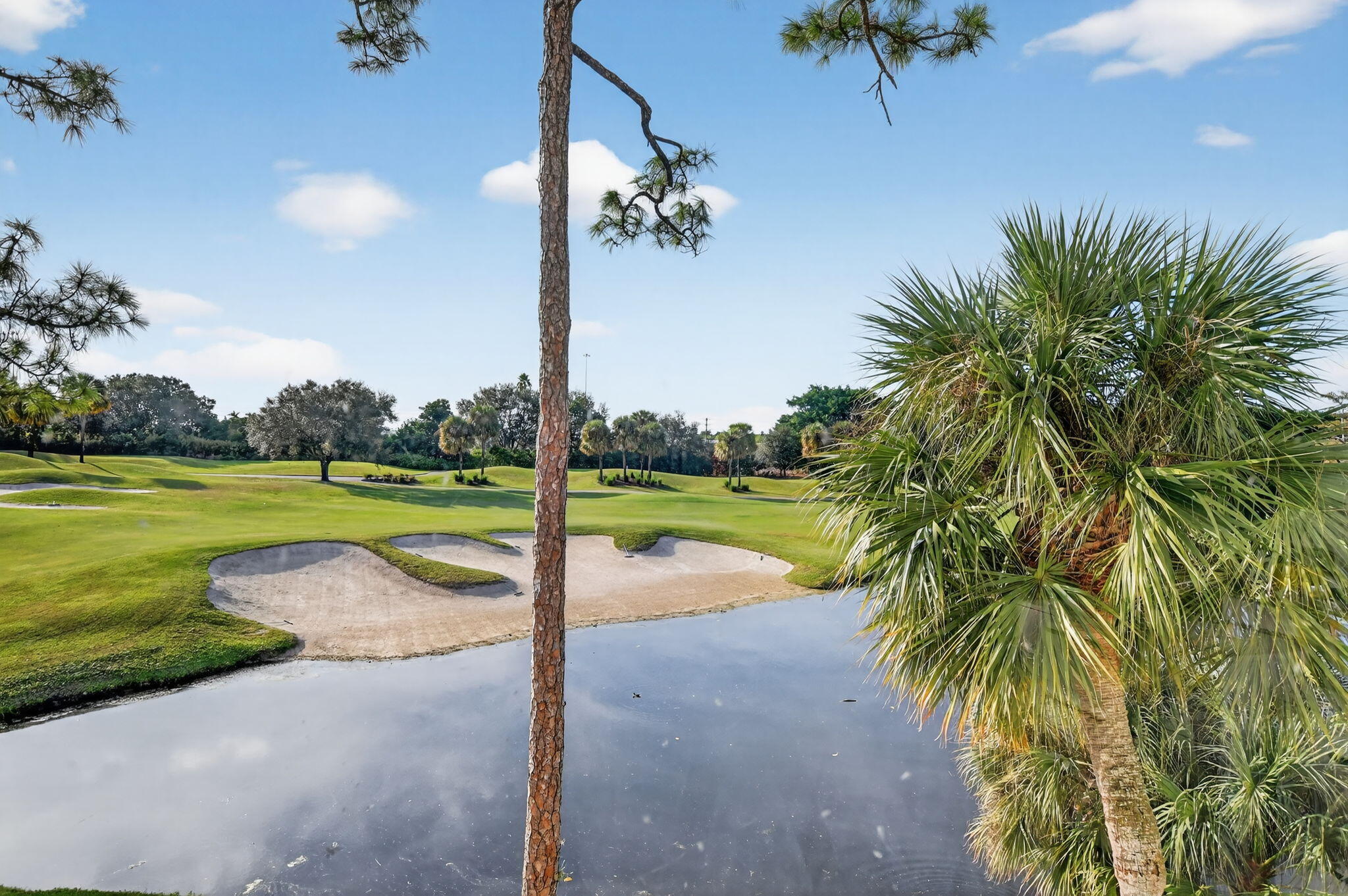 7802 Lakeside Boulevard, Unit 734 Boca Raton, FL 33434 - Photo 25 of 34 a view of a swimming pool and a yard