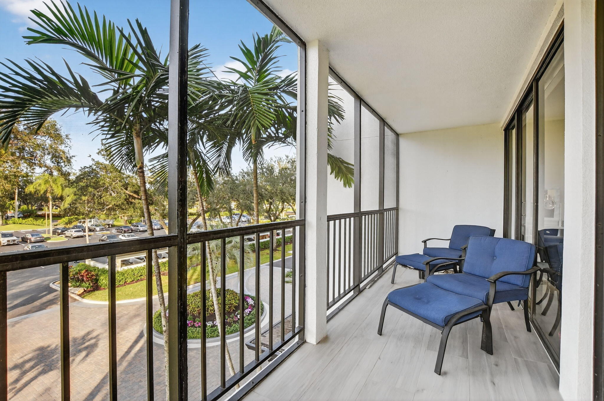 7802 Lakeside Boulevard, Unit 734 Boca Raton, FL 33434 - Photo 27 of 34 a balcony with furniture and a potted plant