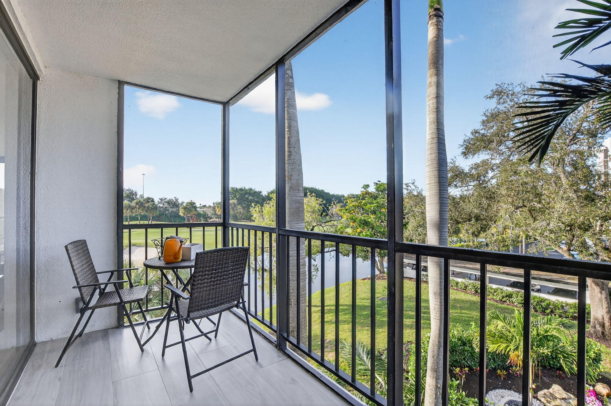 7802 Lakeside Boulevard, Unit 734 Boca Raton, FL 33434 - Photo 28 of 34 a view of a balcony with chair and table
