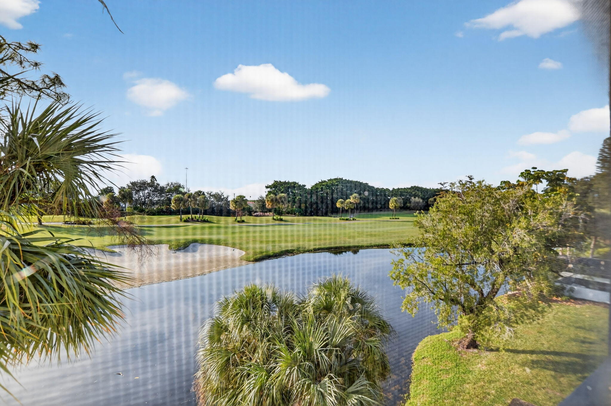 7802 Lakeside Boulevard, Unit 734 Boca Raton, FL 33434 - Photo 29 of 34 a view of a lake with a city