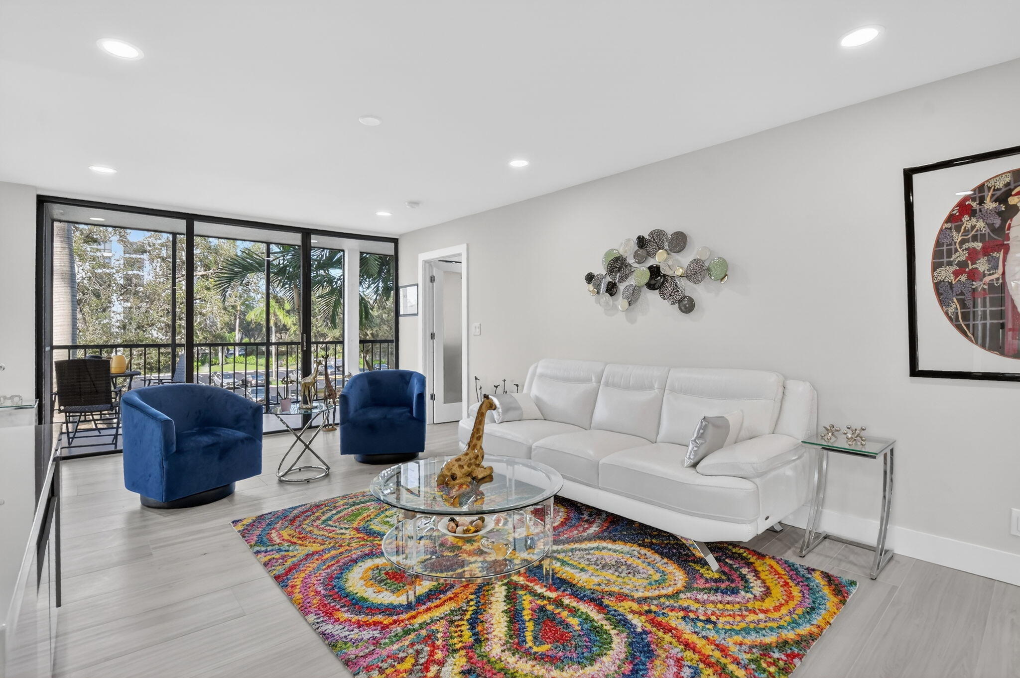 7802 Lakeside Boulevard, Unit 734 Boca Raton, FL 33434 - Photo 3 of 34 a living room with furniture large window and rug