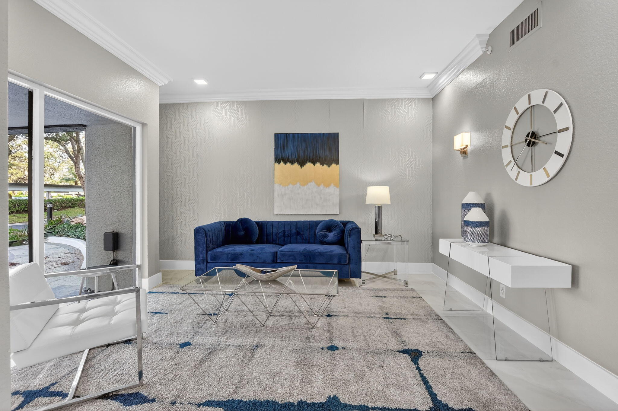 7802 Lakeside Boulevard, Unit 734 Boca Raton, FL 33434 - Photo 34 of 34 a living room with furniture and a large window