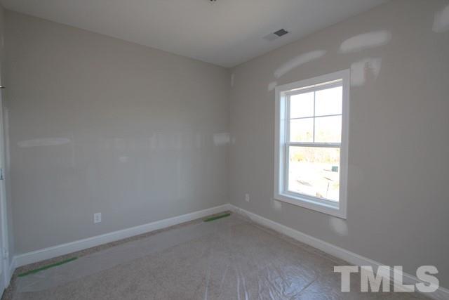 6204 Cotter Ridge Court Raleigh, NC 27603 - Photo 14 of 21 an empty room with a window