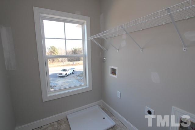 6204 Cotter Ridge Court Raleigh, NC 27603 - Photo 16 of 21 a bathroom with a window