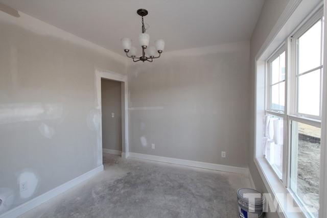 6204 Cotter Ridge Court Raleigh, NC 27603 - Photo 5 of 21 a view of a livingroom with a ceiling fan and window