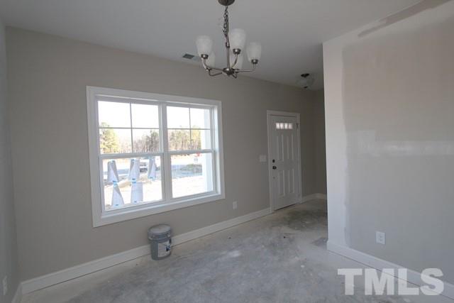 6204 Cotter Ridge Court Raleigh, NC 27603 - Photo 6 of 21 a view of an empty room with a window