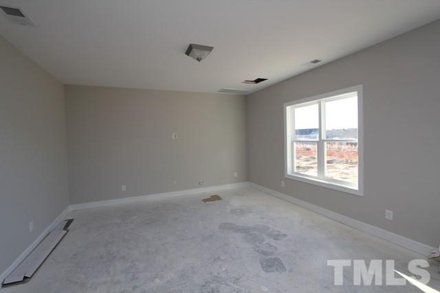 6204 Cotter Ridge Court Raleigh, NC 27603 - Photo 7 of 21 an empty room with a window