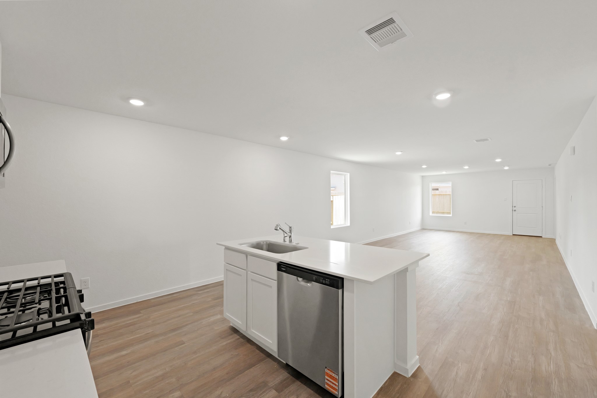 941 Sutherland Falls Street Conroe, TX 77303 - Photo 5 of 24 a kitchen with a sink and cabinets