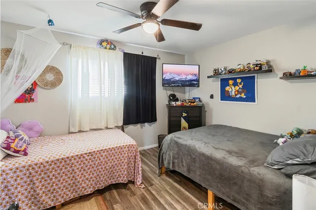 a bedroom with a bed and dresser