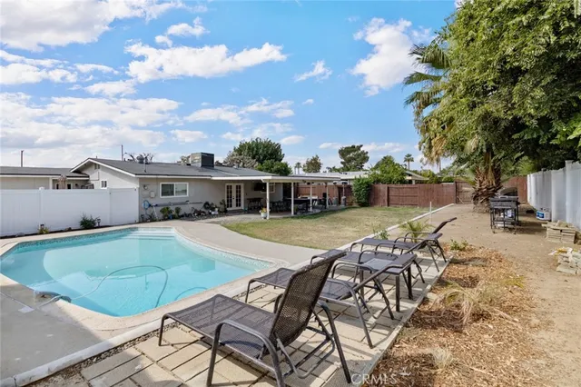 a view of a swimming pool with a lounge chairs