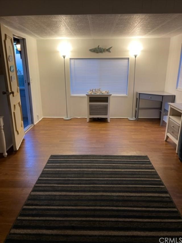 10200 Johnson Road, Unit 44 Phelan, CA 92371 - Photo 15 of 29 a view of kitchen with furniture and wooden floor