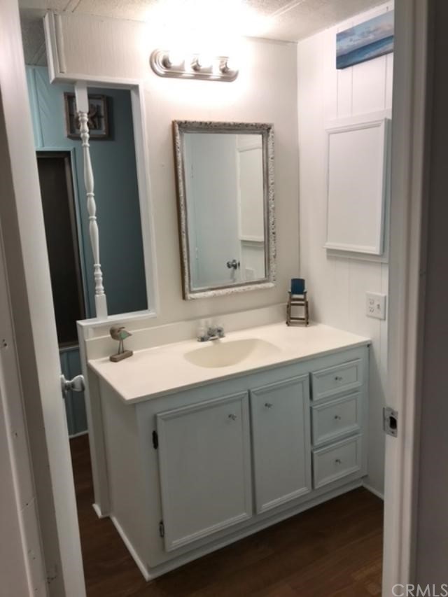 10200 Johnson Road, Unit 44 Phelan, CA 92371 - Photo 17 of 29 a bathroom with a double vanity sink and mirror