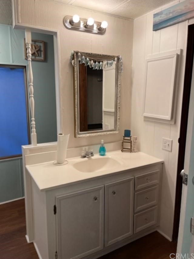 10200 Johnson Road, Unit 44 Phelan, CA 92371 - Photo 18 of 29 a bathroom with a double vanity sink and mirror