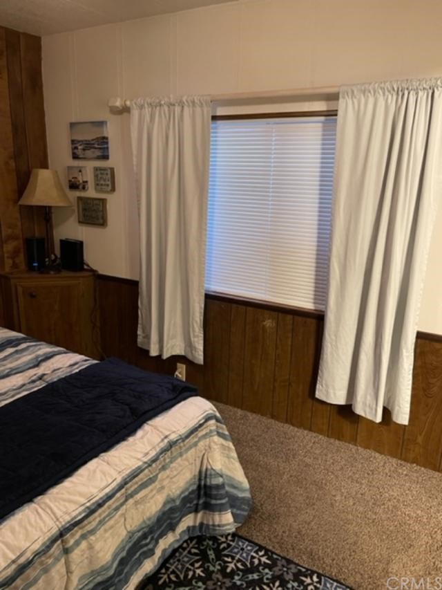 10200 Johnson Road, Unit 44 Phelan, CA 92371 - Photo 21 of 29 a bedroom with a bed and a window