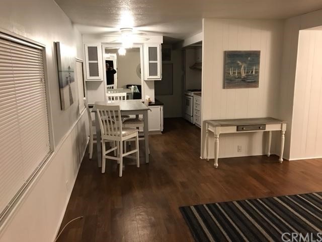 10200 Johnson Road, Unit 44 Phelan, CA 92371 - Photo 7 of 29 a dining room with furniture and wooden floor