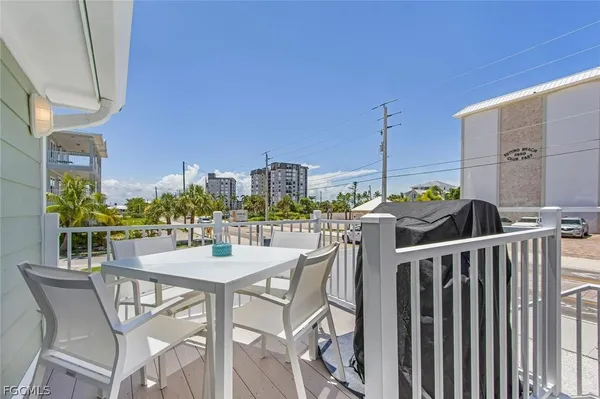 a view of a balcony with chairs