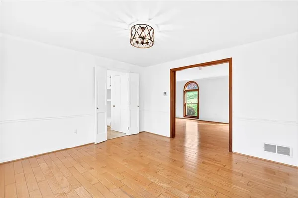 a view of a storage & utility room with wooden floor