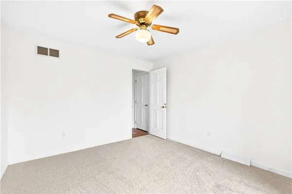 a view of a ceiling fan in a room