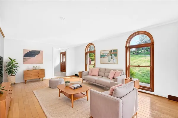 a living room with furniture and a large window