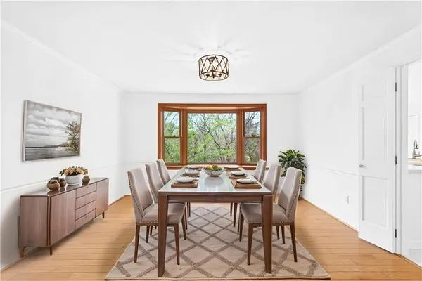 a view of a dining room with furniture window and outside view