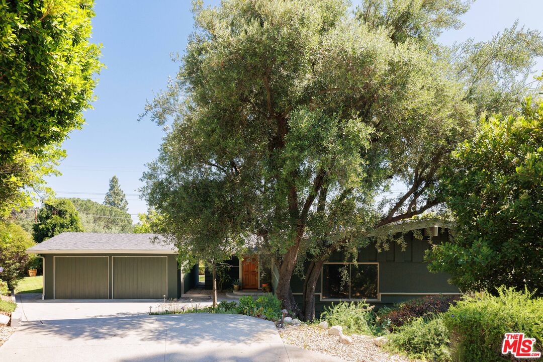 580 Cocopan Drive Altadena, CA 91001 - Photo 1 of 29 a front view of a house with a yard and garage