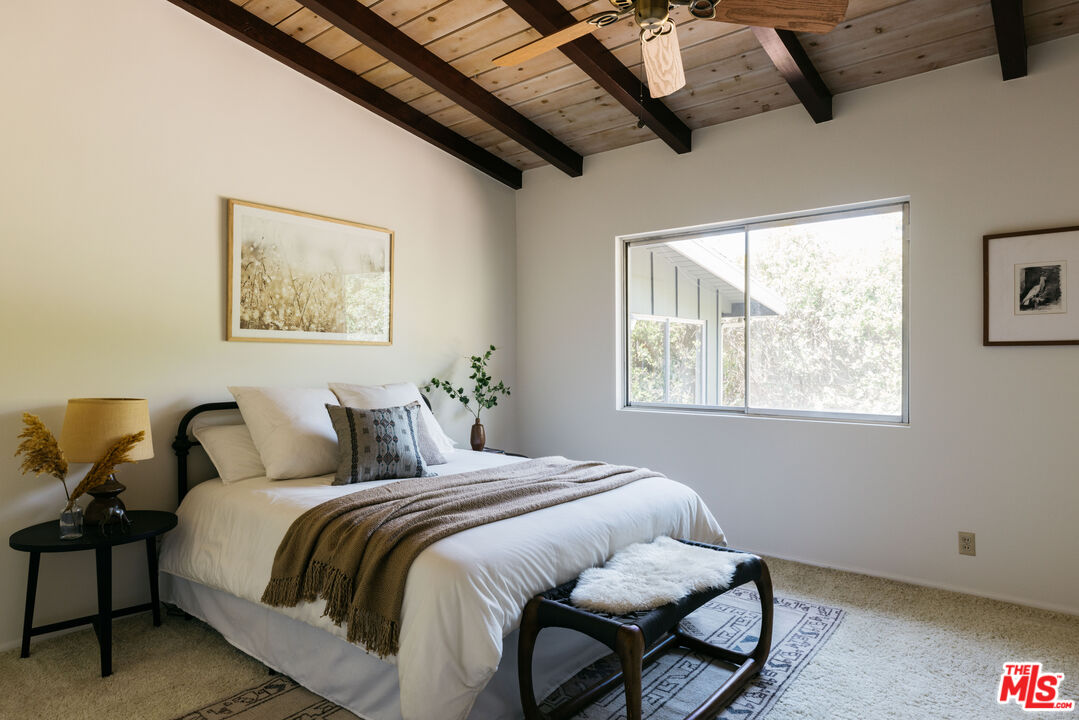 580 Cocopan Drive Altadena, CA 91001 - Photo 20 of 29 a bedroom with a bed and wooden floor
