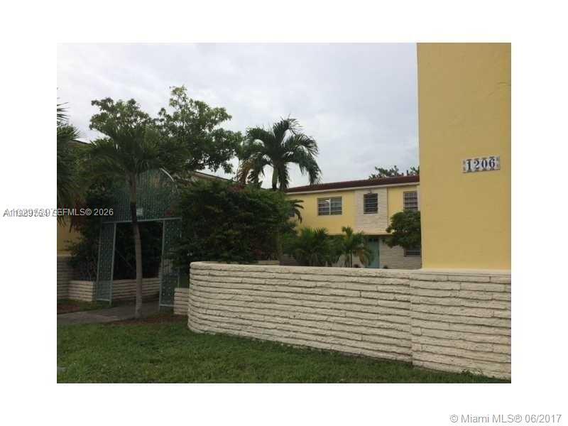 1206 Douglas Road, Unit 1 Coral Gables, FL 33134 - Photo 1 of 1 a view of a house with a backyard