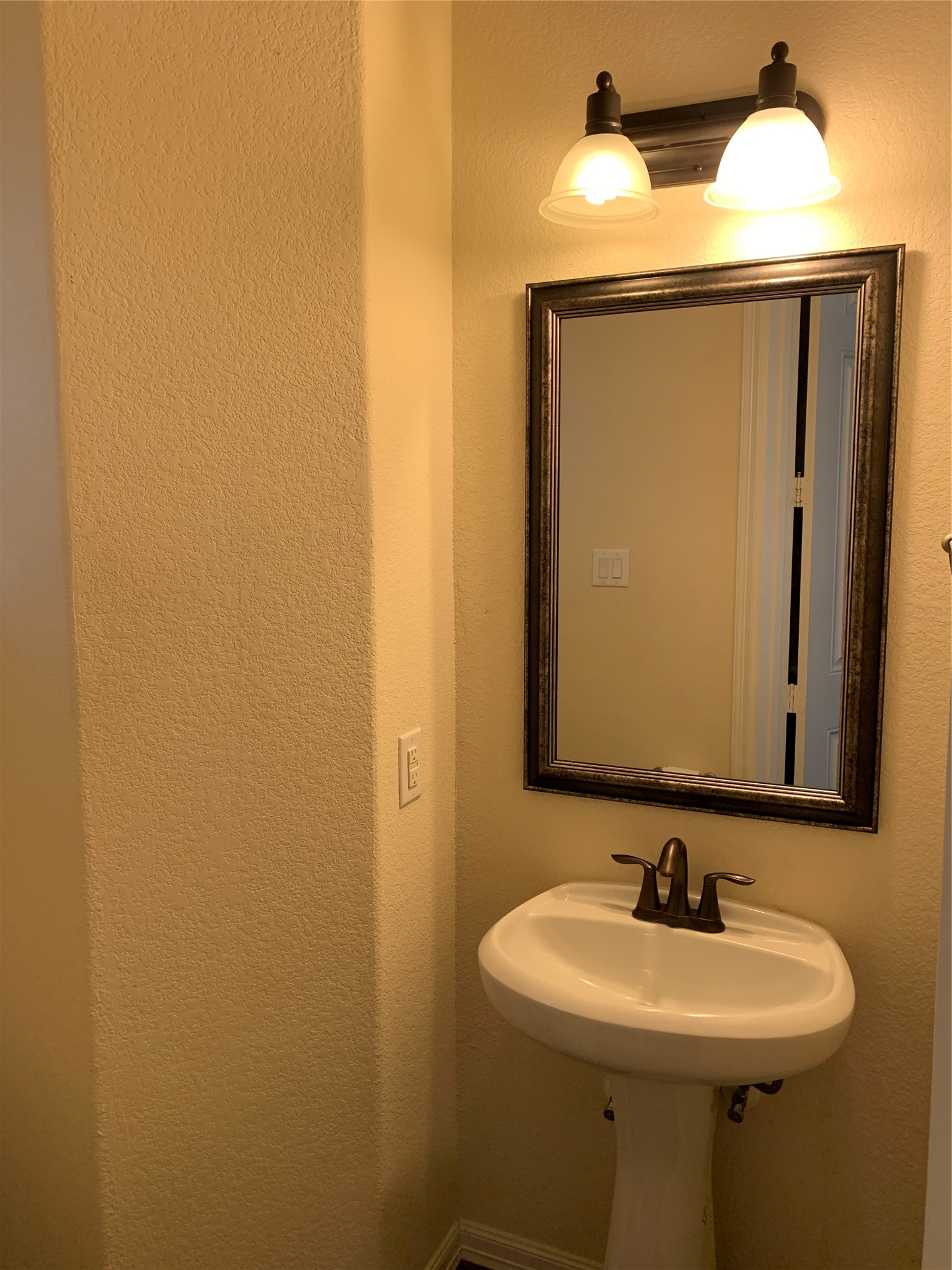 3021 Kisling Street Houston, TX 77021 - Photo 12 of 27 a bathroom with a sink and a mirror