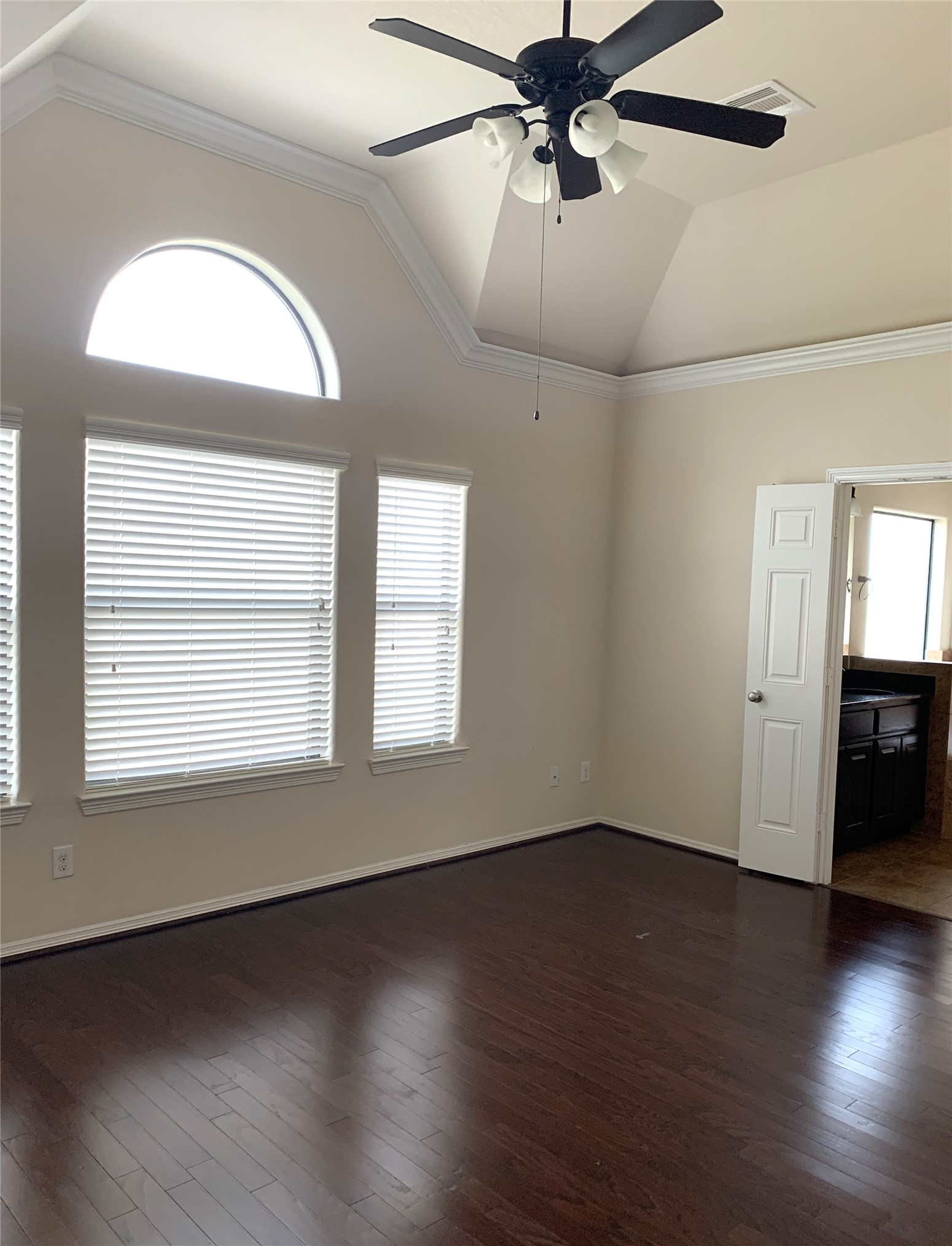 3021 Kisling Street Houston, TX 77021 - Photo 14 of 27 an empty room with wooden floor fan and windows