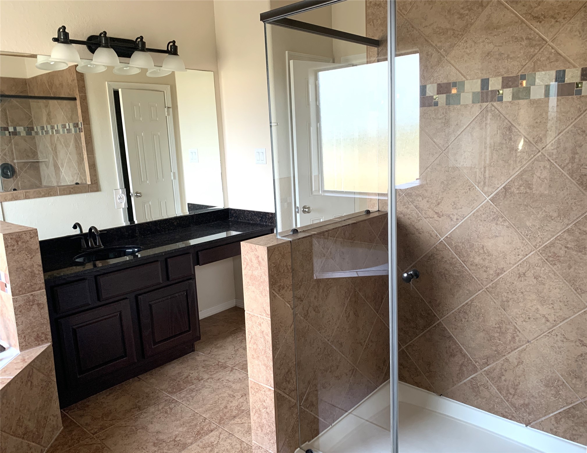 3021 Kisling Street Houston, TX 77021 - Photo 18 of 27 a bathroom with a granite countertop sink and a mirror