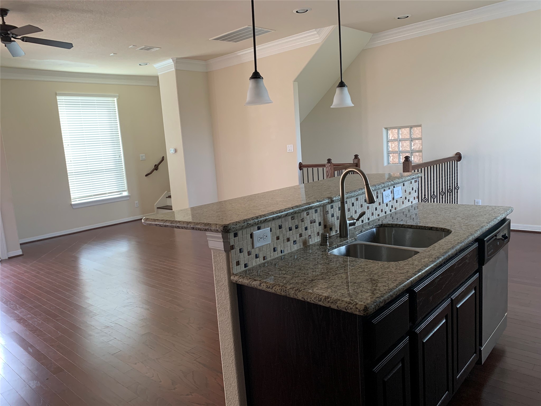 3021 Kisling Street Houston, TX 77021 - Photo 8 of 27 a kitchen with a sink a faucet a potted plant and wooden floor
