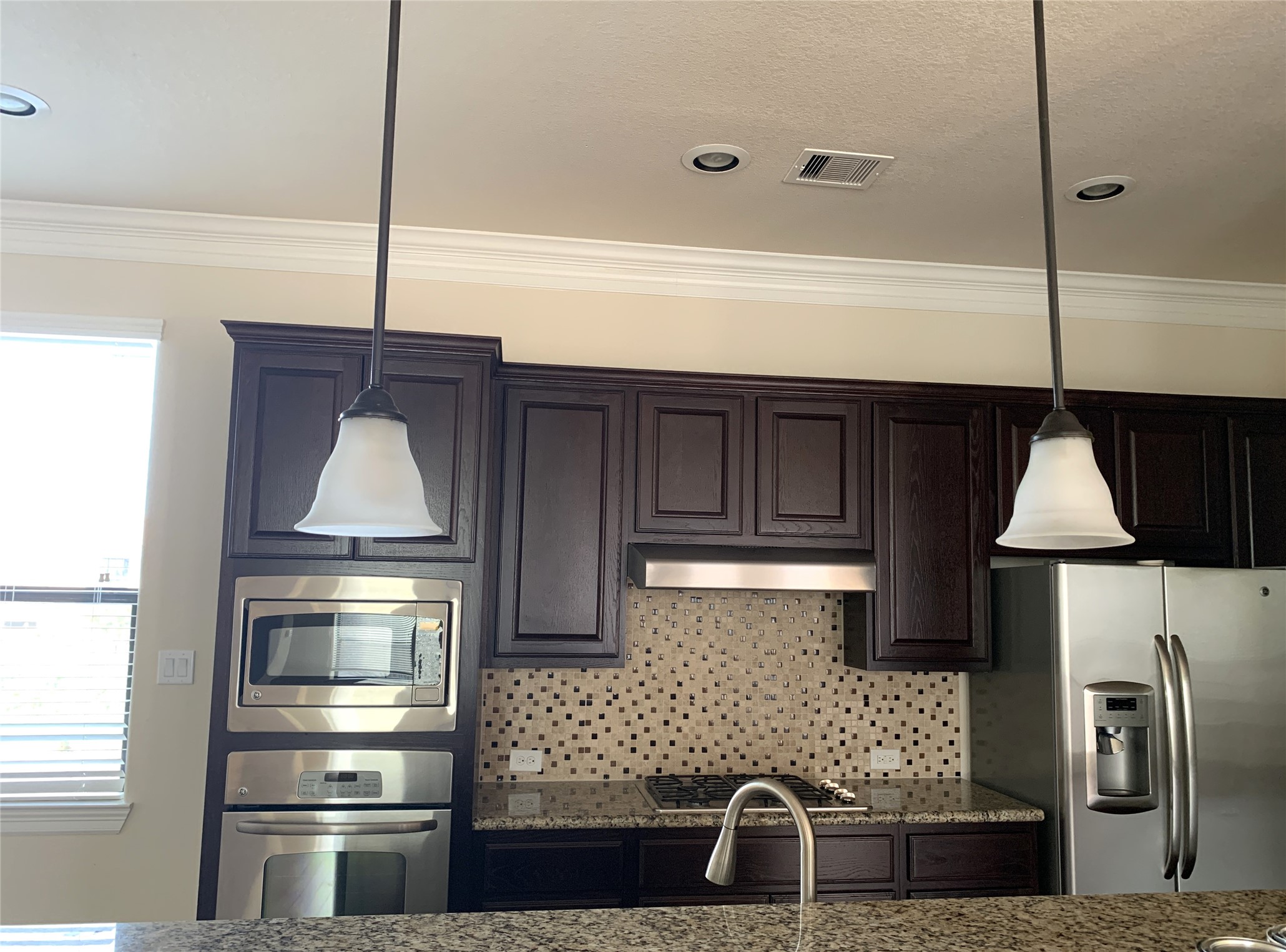 3021 Kisling Street Houston, TX 77021 - Photo 9 of 27 a kitchen with a sink and a refrigerator
