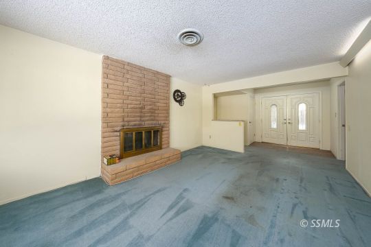 736 Sherri Street Ridgecrest, CA 93555 - Photo 6 of 42 a view of an empty room with wooden floor and a window