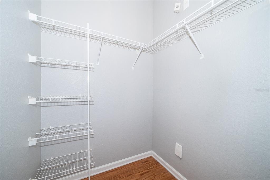 581 Brantley Terrace Way, Unit 202 Altamonte Springs, FL 32714 - Photo 20 of 25 a view of a room with racks on the wall
