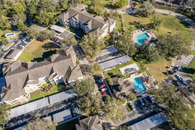 an aerial view of residential houses with outdoor space