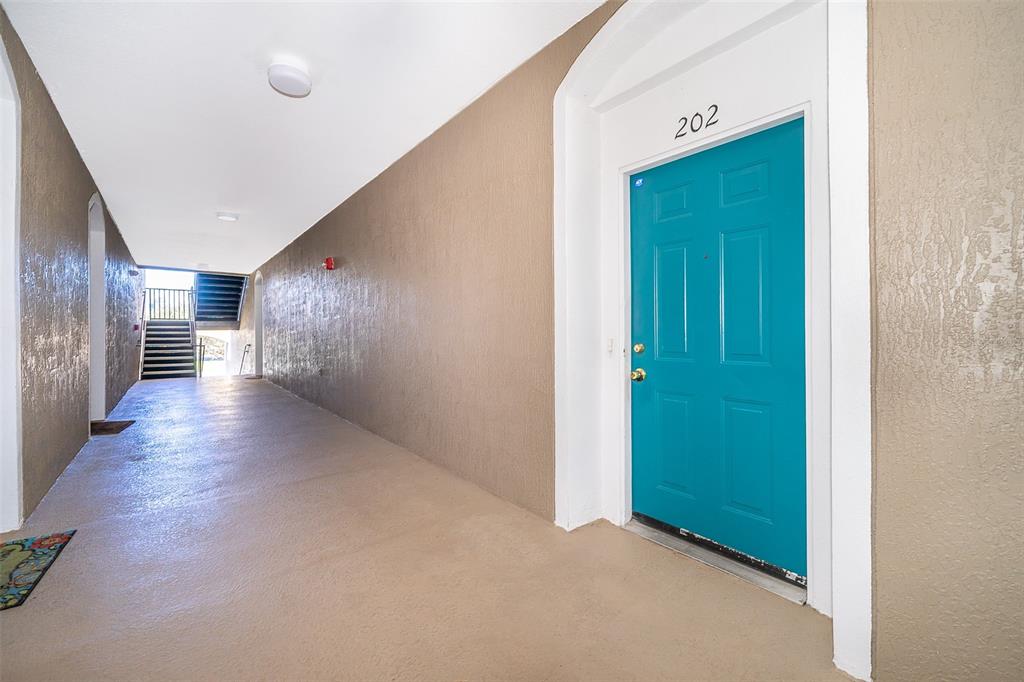 581 Brantley Terrace Way, Unit 202 Altamonte Springs, FL 32714 - Photo 5 of 25 a view of hallway with wooden floor