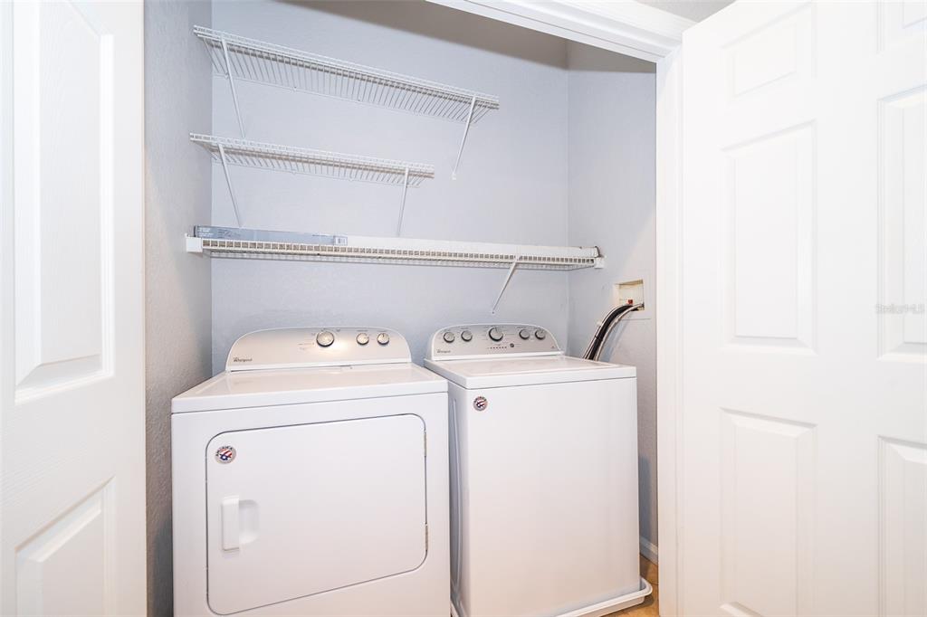 581 Brantley Terrace Way, Unit 202 Altamonte Springs, FL 32714 - Photo 7 of 25 a utility room with dryer and washer