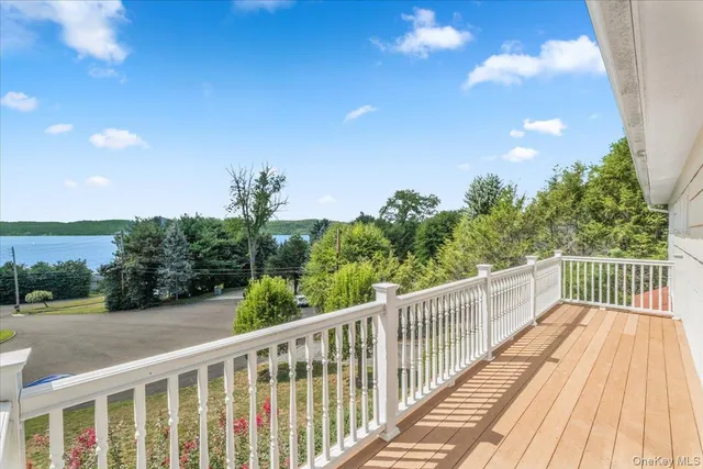 a view of balcony with wooden floor