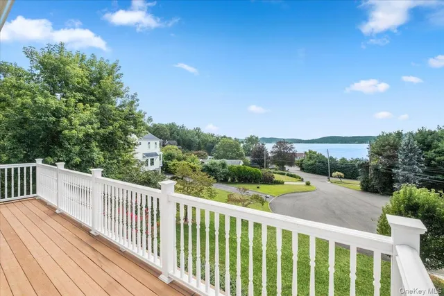 a view of a balcony with wooden floor