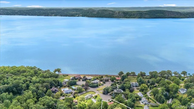 an aerial view of a houses with a yard