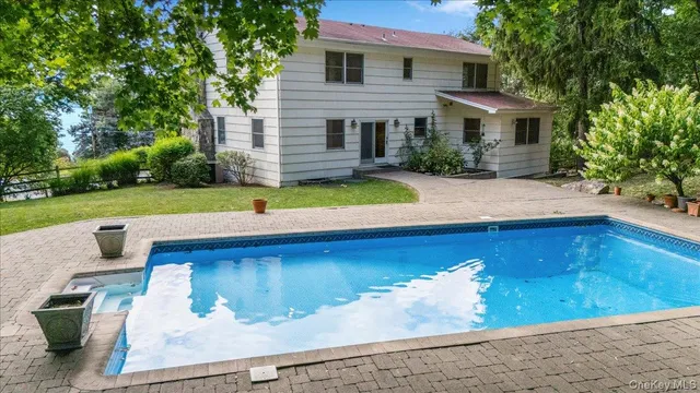 a view of a house with a swimming pool