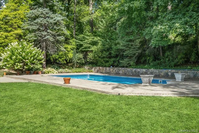 a view of a swimming pool with a patio