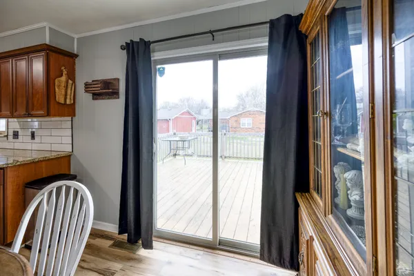 a view of front door with wooden floor