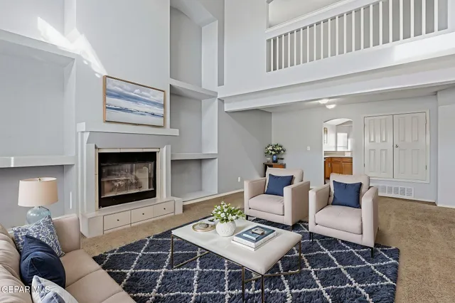 a kitchen with stainless steel appliances granite countertop a sink and a refrigerator