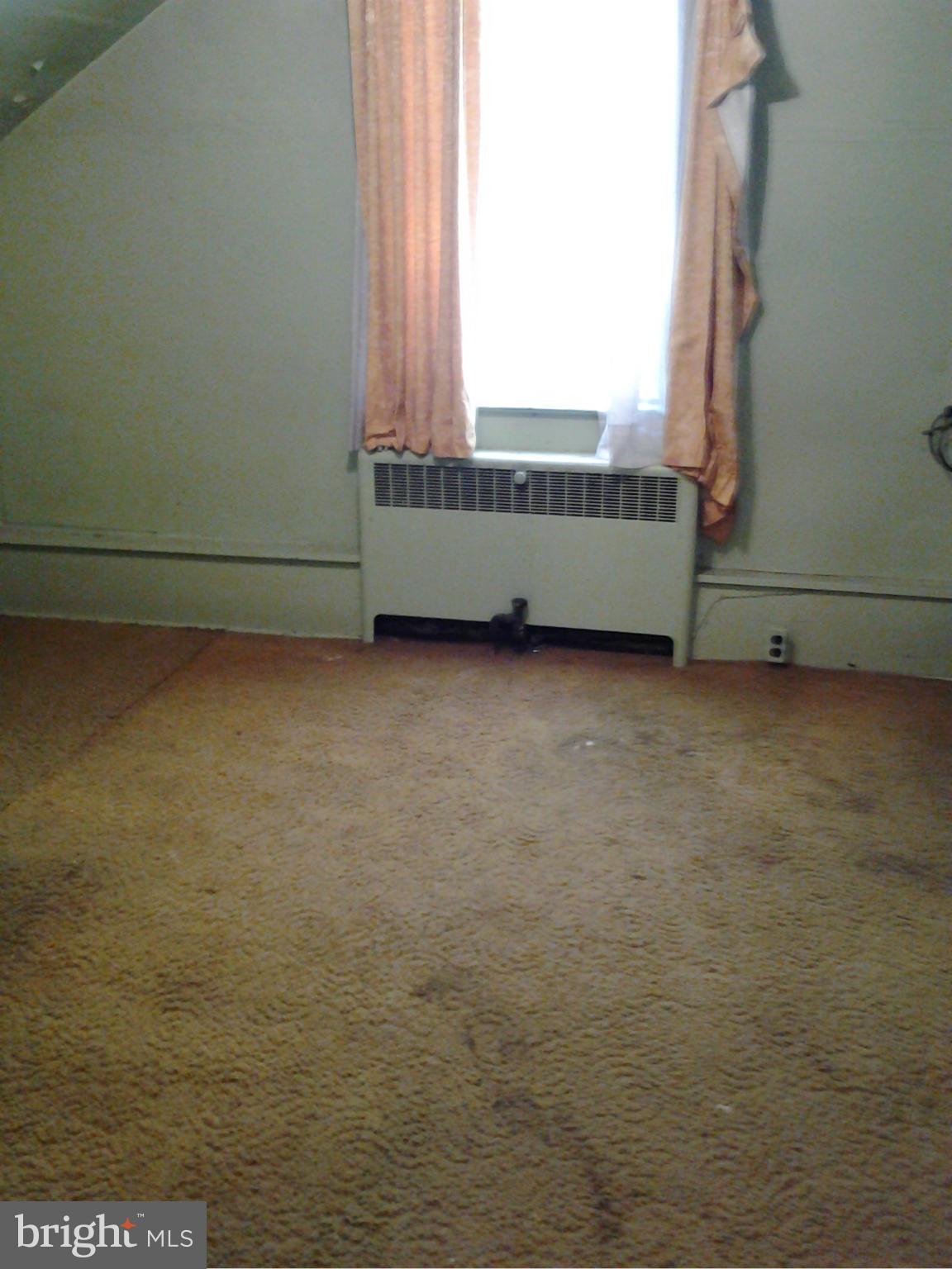 925 Bridgeview Road Baltimore, MD 21225 - Photo 3 of 13 a view of an empty room and window