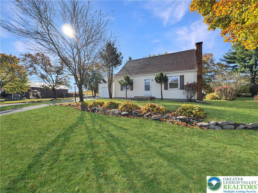 a view of a house with a big yard